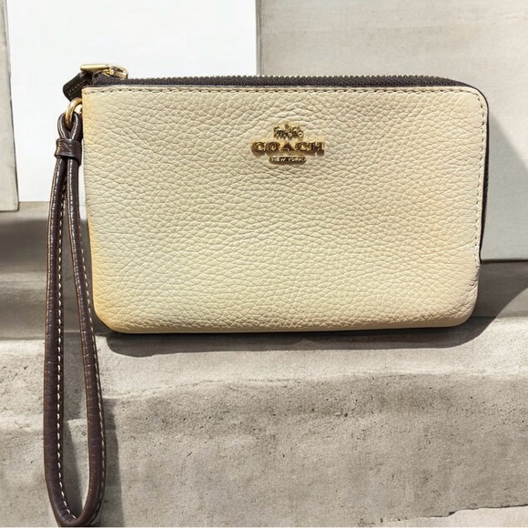 Coach Handbags - Coach Beige and Brown Wristlet